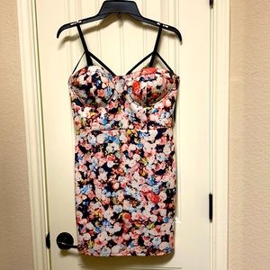 Jaw dropping form fitting floral dress.